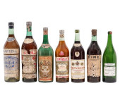 SEVEN LARGE GLASS LIQUOR BOTTL