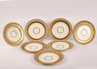 Seven Minton plates with gilt