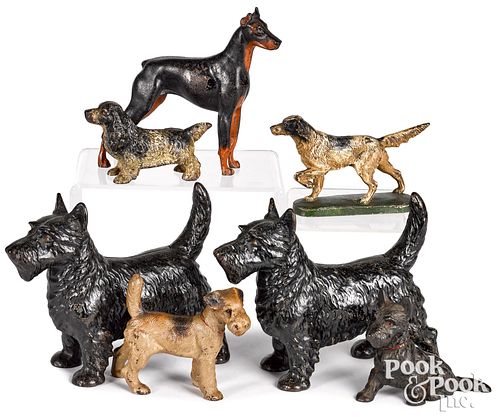 SEVEN PAINTED CAST IRON DOORSTOPS
