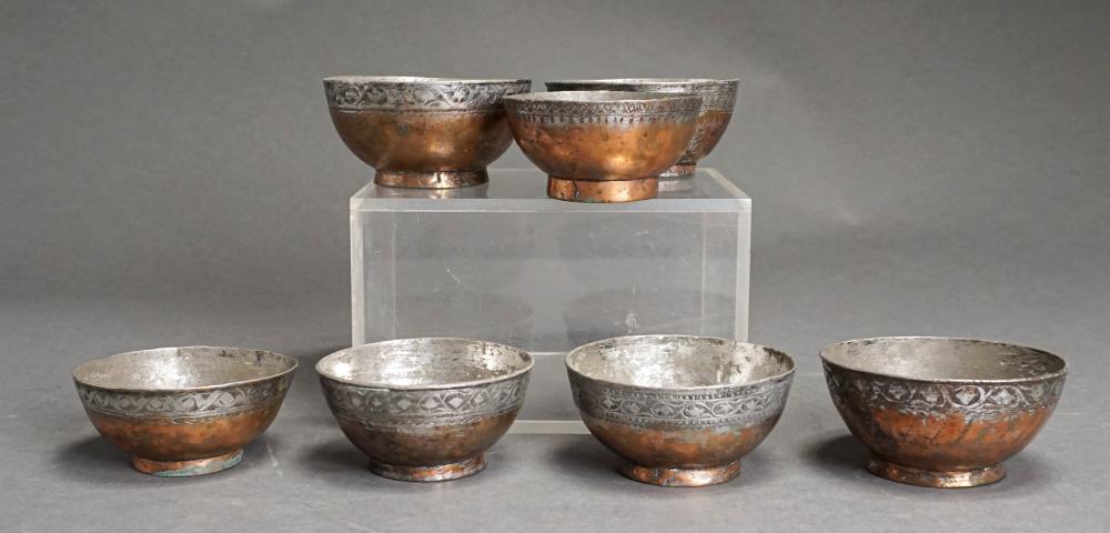 SEVEN PERSIAN TIN AND COPPER BOWLS,
