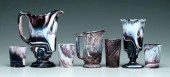 Seven pieces purple slag glass