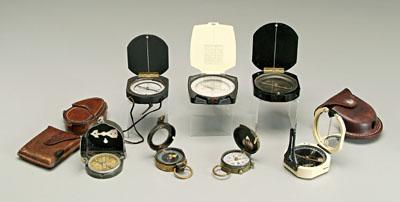 Seven pocket compasses: K&E,
