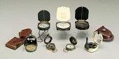 Seven pocket compasses: K&E, b