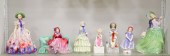 SEVEN PORCELAIN FIGURINES.  En