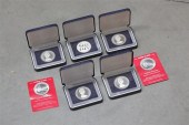 SEVEN SILVER ISLAND COINS. Two