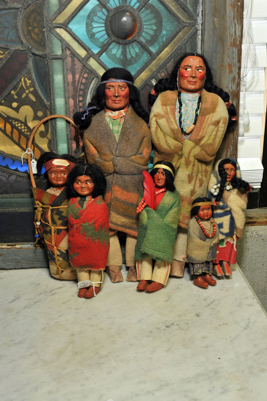SEVEN SKOOKUM DOLLS. Five male