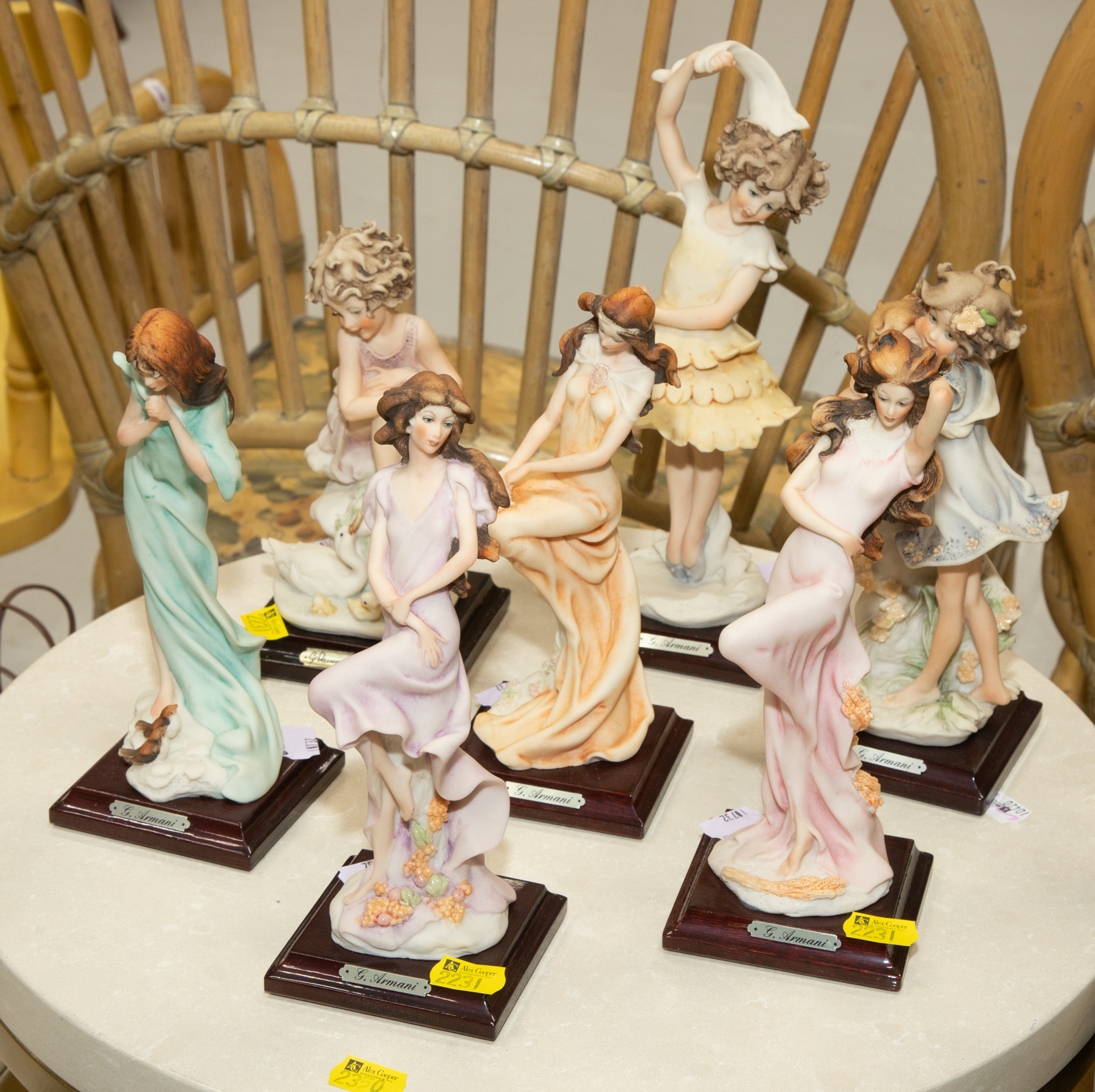 SEVEN SMALL ARMANI FIGURES .
