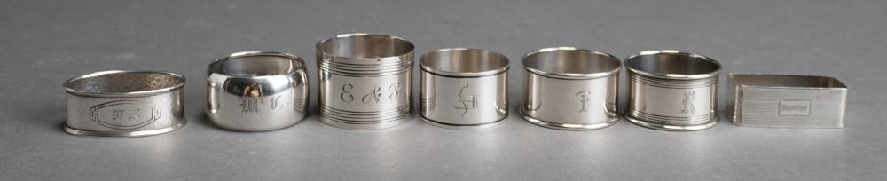 SEVEN STERLING SILVER NAPKIN RINGS,