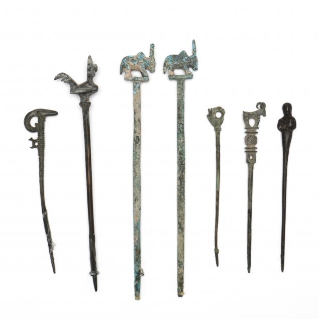SEVEN UNIDENTIFIED BRONZE HAIRPINS,
