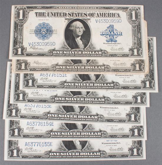 Seven United States $1.00 silver