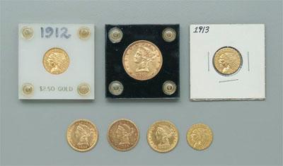 Seven U.S. gold coins: one $10