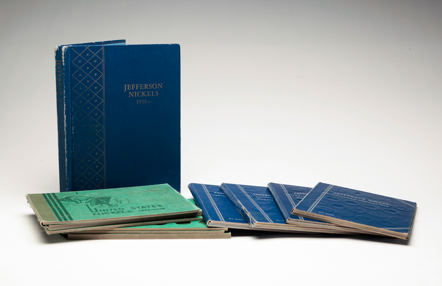 SEVEN U.S. NICKEL COIN FOLDERS.