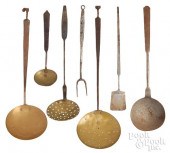 SEVEN WROUGHT IRON AND BRASS U