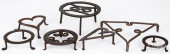 SEVEN WROUGHT IRON TRIVETS, 19