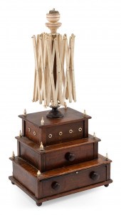 SEWING BOX SURMOUNTED BY A SWI