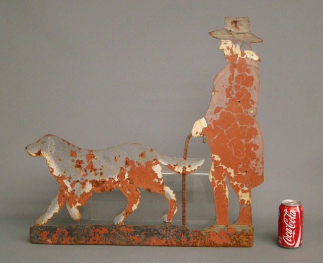 Sheet metal painted man walking dog