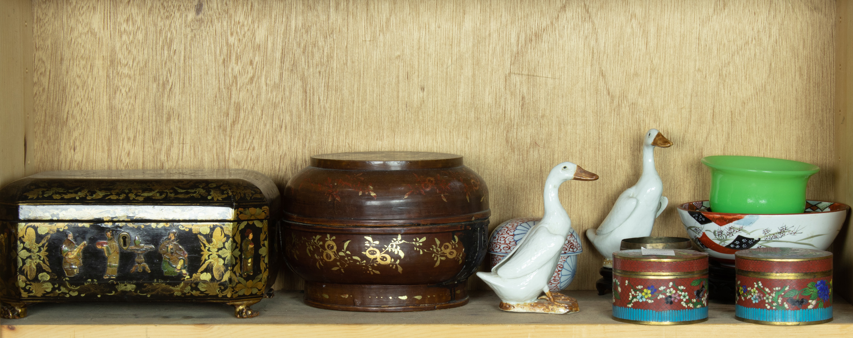 SHELF OF ASIAN DECORATIVE ITEMS