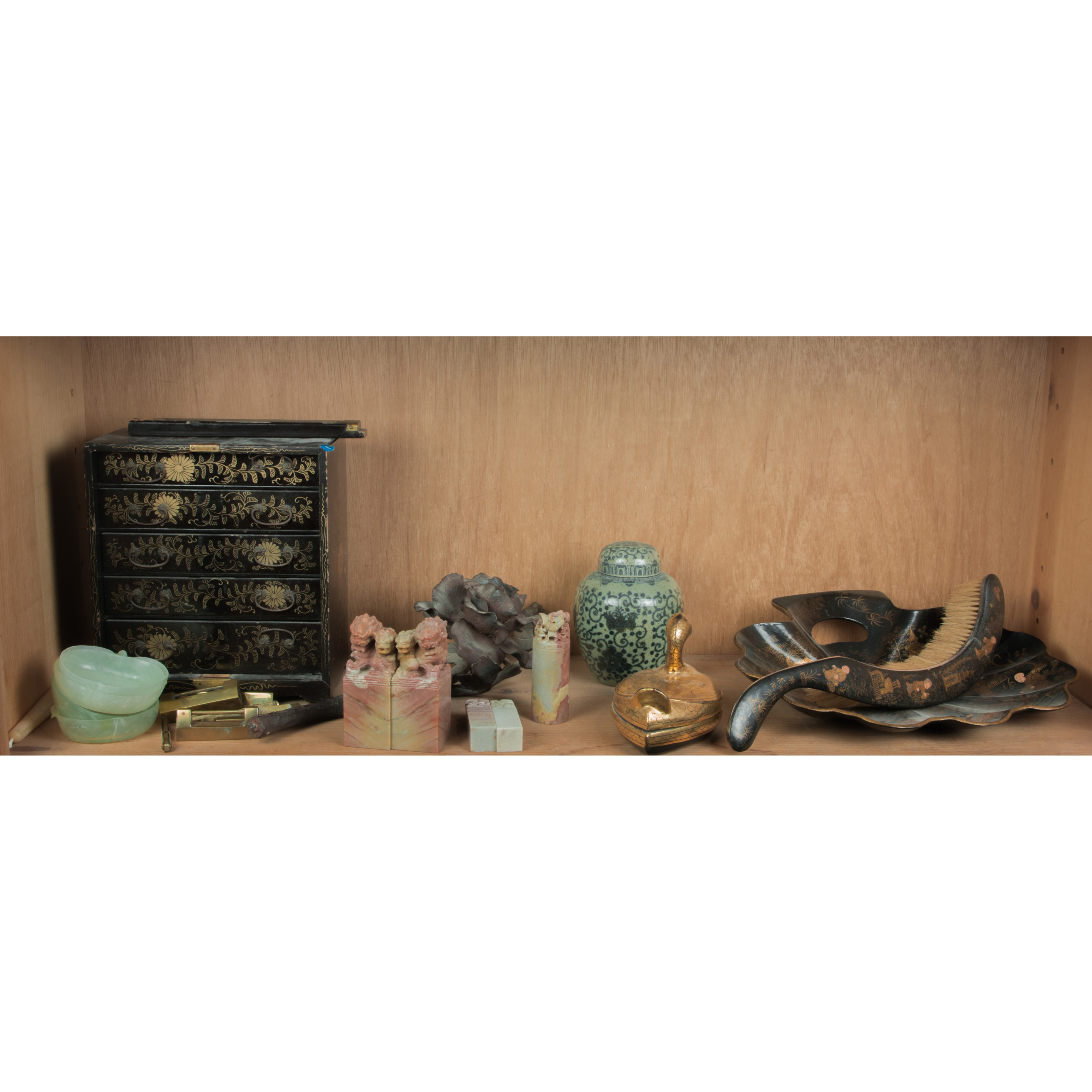 SHELF OF ASIAN DECORATIVE ITEMS