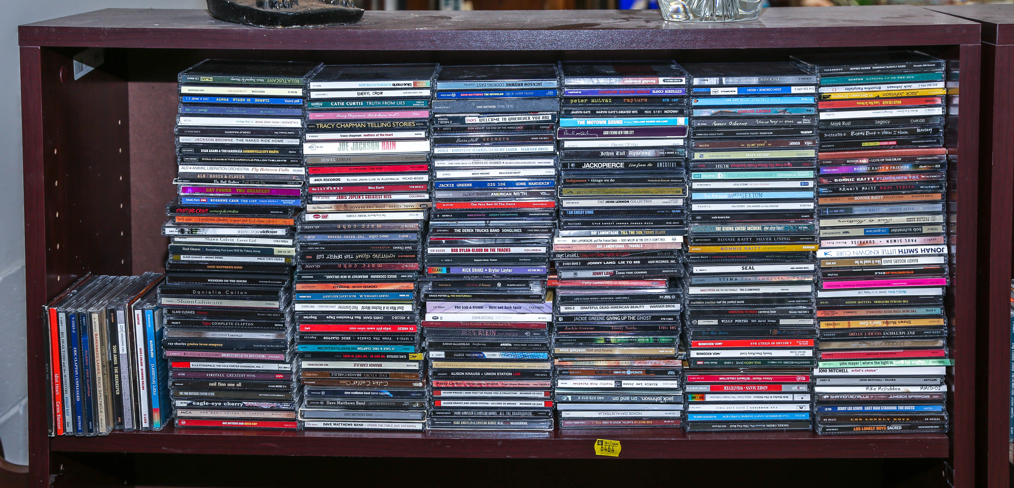 SHELF OF ASSORTED MUSICAL CDS