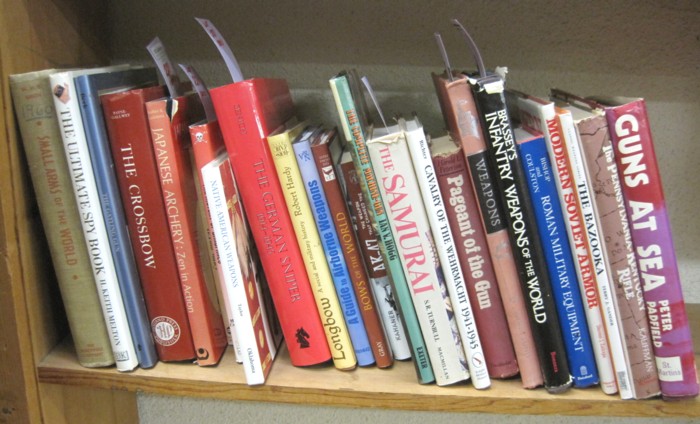 SHELF OF COLLECTIBLE BOOKS relating