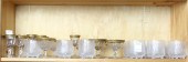 SHELF OF GILT RIMMED STEMWARE