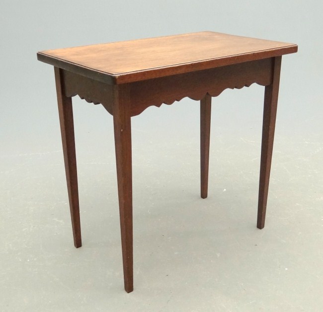 Side table with shaped apron and