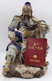 SIGNED ENAMEL DECORATED SEATED