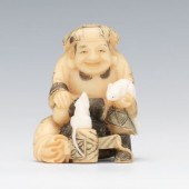 Signed Netsuke of Man with Whi