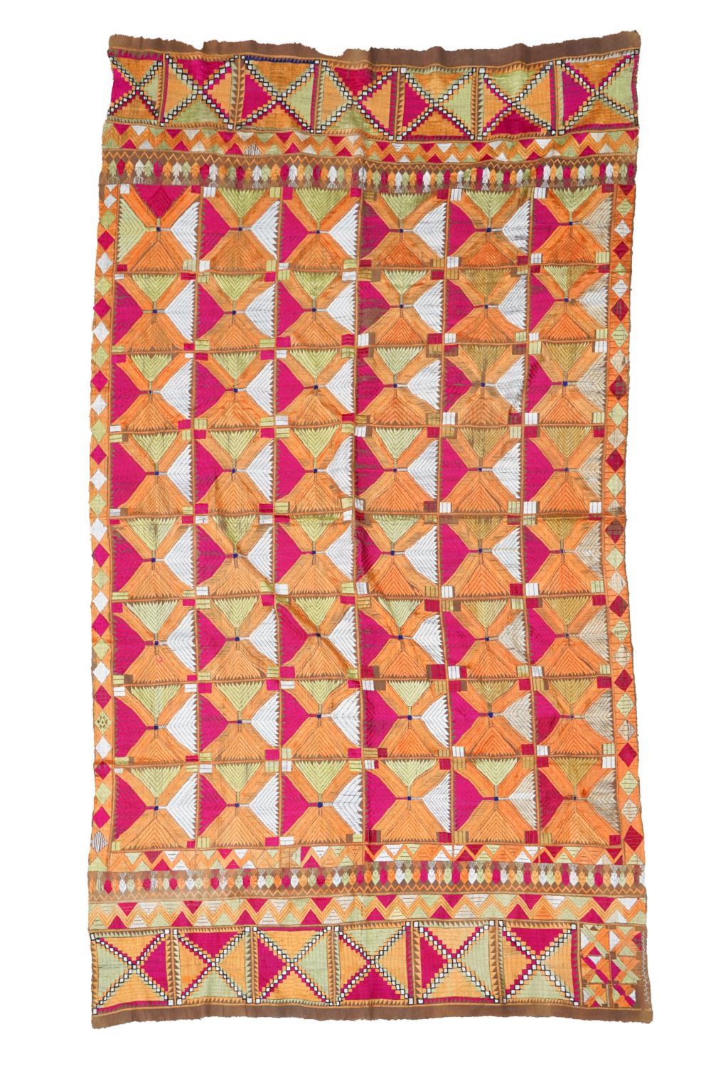 SILK-EMBROIDERED TEXTILEon brown