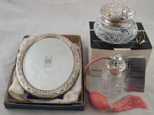 Silver. A mirror with strut back 17
