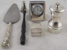Silver. A pepper mill a candle
