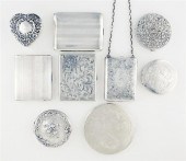 Silver compacts purse dresser