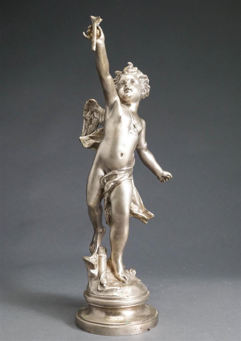 SILVER PAINTED METAL FIGURE OF A