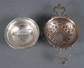 Silver tea strainer and partia