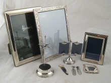 Silver. Three photo frames being