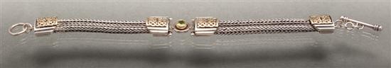 Silver, yellow gold and peridot