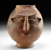 SINU FOOTED VESSEL HUMAN HEAD