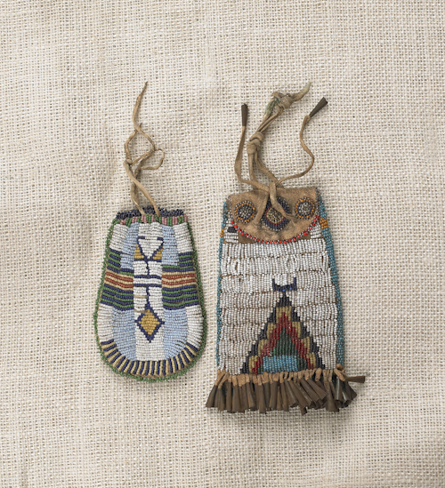 Sioux beaded hide pouch with tin
