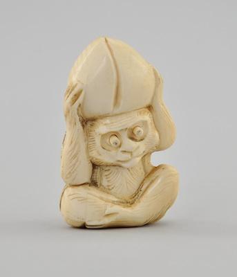 Sitting Monkey with Coconut on