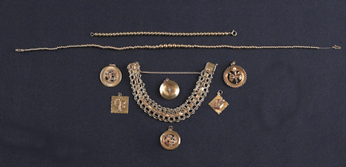 Six 14K gold charms some with