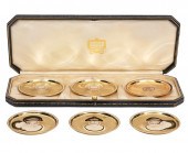 SIX 14K YG CARTIER COASTERS IN