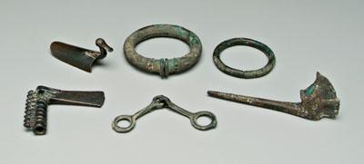 Six ancient bronze objects: axe