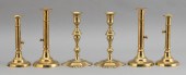 SIX ANTIQUE BRASS CANDLESTICKS