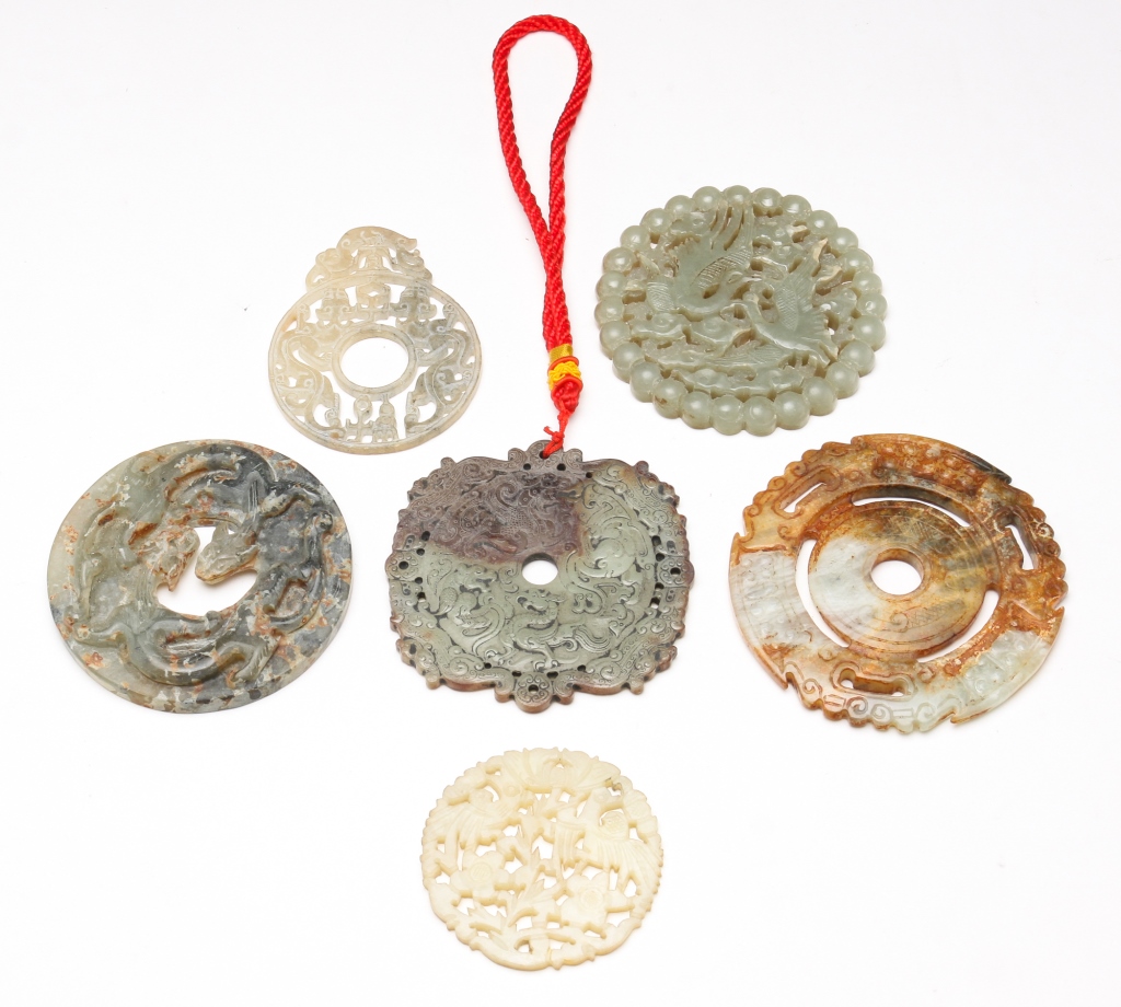 SIX ASIAN CARVED STONE DISKS AND