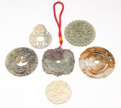 SIX ASIAN CARVED STONE DISKS A