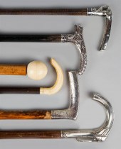 SIX ASSORTED WALKING CANESSIX