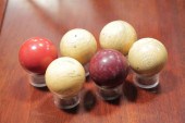 SIX BILLIARD BALLS. Four white