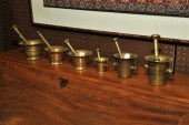 SIX BRASS MORTARS AND PESTLES.