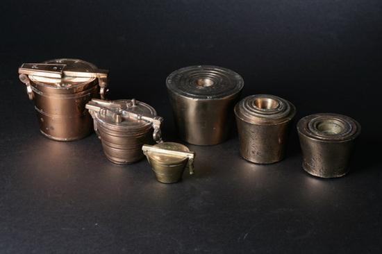 SIX BRASS NESTING WEIGHTS.