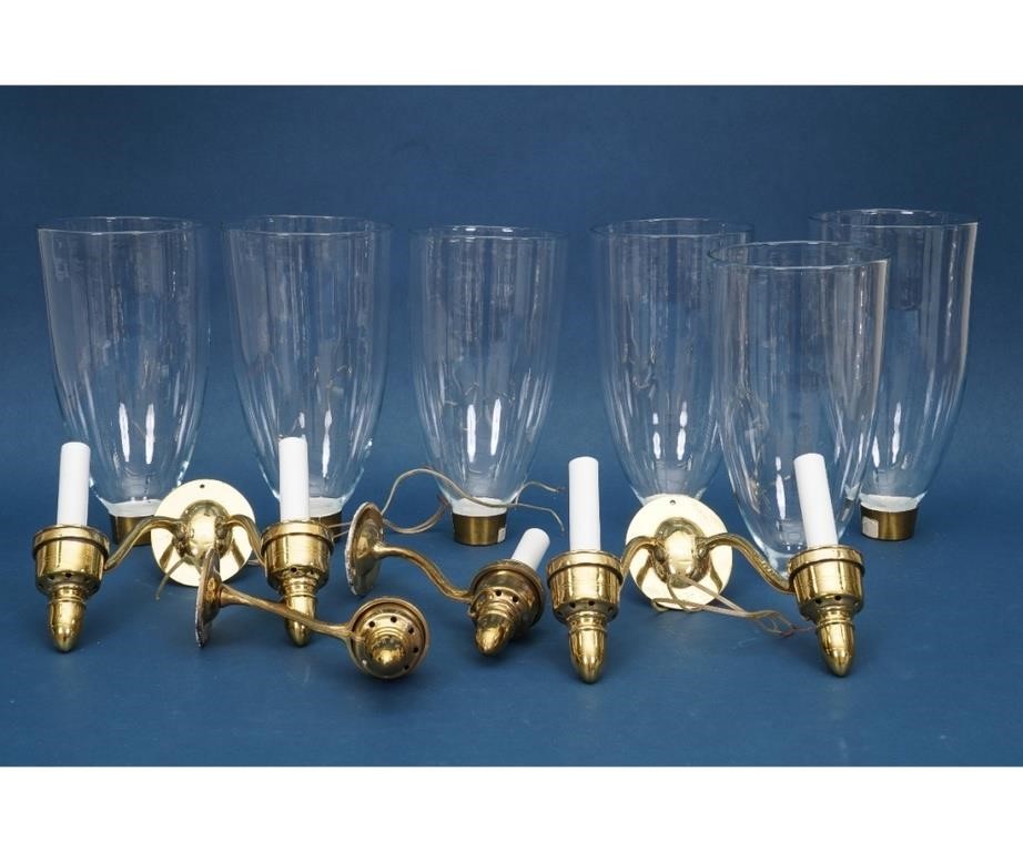 Six brass wall sconces with